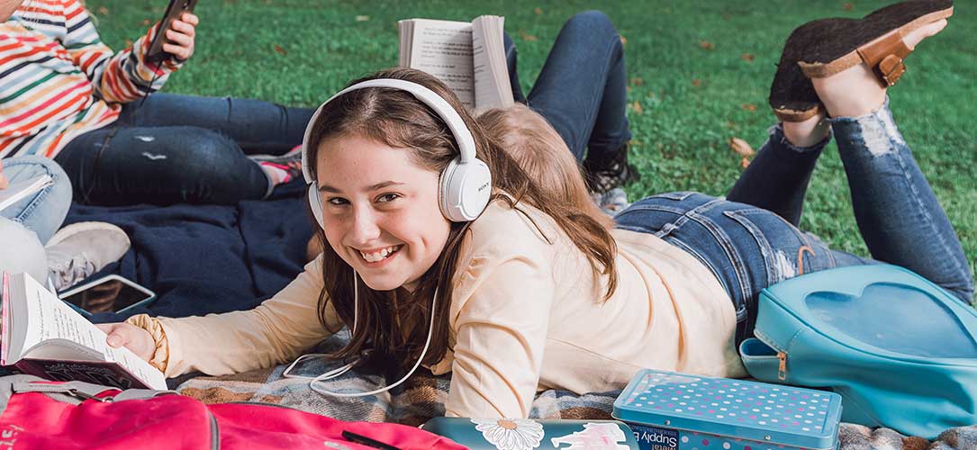 Girl in headphones smiling